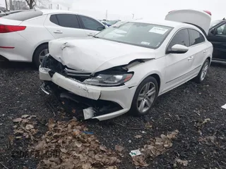 2014 Volkswagen CC Sport with VIN WVWBN7AN4EE505014, listed as a IAAI auction lot 41520345 with 140,422 mi miles and . Bid and sale history available at DreamBid. Image 2.