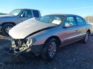 2002 Lincoln Continental with VIN 1LNHM97V12Y699605, listed as a IAAI auction lot 41235748 with 1 mi miles. Bid and sale history available at carsss.com. Image 2.