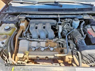 2005 Ford Five Hundred SE z VIN 1FAFP23135G155457, wystawiony jako Copart lot #59118245 z przebiegiem 157 582 mil mil oraz Tytuł czysty. Historia ofert i sprzedaży dostępna na DreamBid. Obrazek 7.
