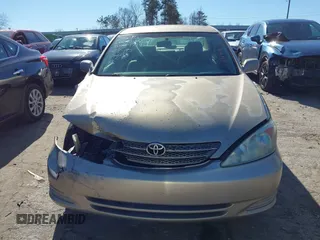 2002 Toyota Camry LE z VIN 4T1BE32K02U051709, wystawiony jako IAAI lot #41485620 z przebiegiem 232 876 mil mil oraz . Historia ofert i sprzedaży dostępna na DreamBid. Obrazek 12.