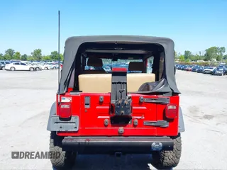 1999 Jeep Wrangler Sport with VIN 1J4FY19S0XP468304, listed as a IAAI auction lot 40038580 with 123,247 mi miles. Bid and sale history available at carsss.com. Image 16.