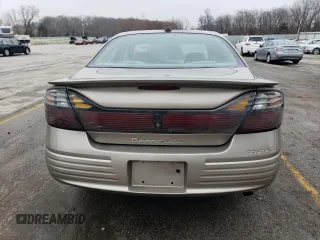 2004 Pontiac Bonneville SE z VIN 1G2HX52K44U242321, wystawiony jako Copart lot #43754495 z przebiegiem 222 658 mil mil oraz Szkody całkowita. Historia ofert i sprzedaży dostępna na DreamBid. Obrazek 6.