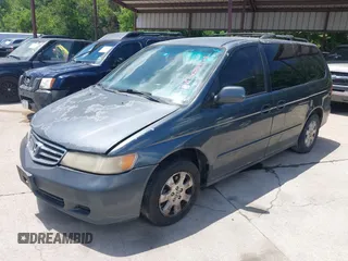 2004 Honda Odyssey EX-L with VIN 5FNRL18974B059223, listed as a IAAI auction lot 42249508 with 247,856 mi miles and . Bid and sale history available at DreamBid. Image 2.