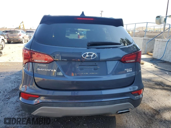 2018 Hyundai Santa Fe 2.4L с VIN 5NMZUDLB6JH097285, выставлен на аукционе Copart как лот 62333795 с пробегом 90 476 миль миль и Списание • Salvage title. История ставок и продаж доступна на DreamBid. Изображение 6.