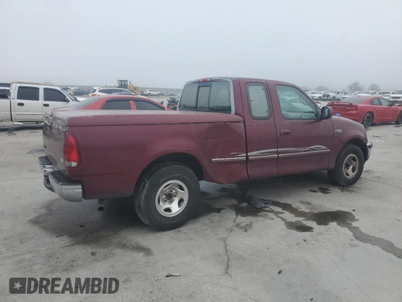 1997 Ford F-150 with VIN 2FTDX1726VCA74811, listed as a Copart auction lot 81909844 with 136,520 mi miles and Salvage title. Bid and sale history available at DreamBid. Image 3.