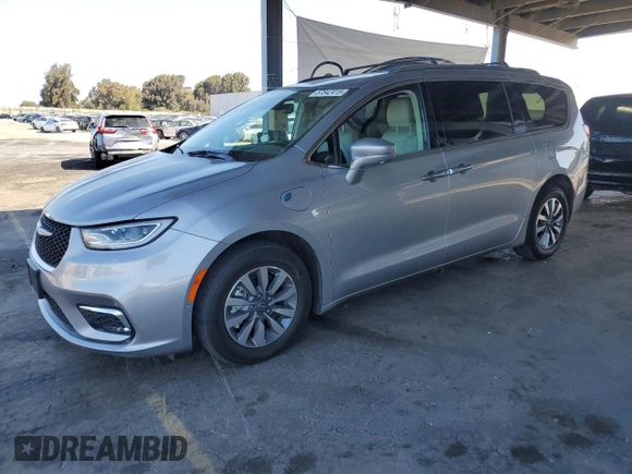 2021 Chrysler Pacifica Hybrid Touring L with VIN 2C4RC1L7XMR593911, listed as a Copart auction lot 57842415 with 74,910 mi miles and Salvage title. Bid and sale history available at DreamBid. Image 1.