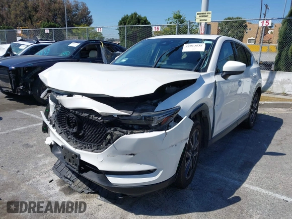 2018 Mazda CX-5 Grand Touring with VIN JM3KFADM8J0373368, listed as a IAAI auction lot 42013535 with 63,142 mi miles and . Bid and sale history available at DreamBid. Image 17.