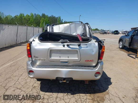 2004 GMC Envoy SLE with VIN 1GKDS13S242420100, listed as a IAAI auction lot 41963800 with 341,395 mi miles and . Bid and sale history available at DreamBid. Image 16.