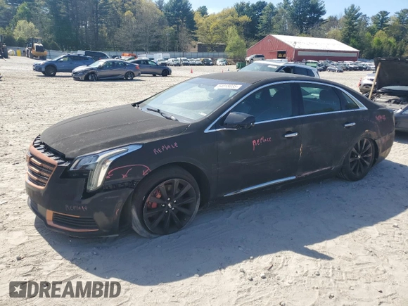 2018 Cadillac XTS Livery z VIN 2G61U5S35J9168773, wystawiony jako Copart lot #54818035 z przebiegiem 62 219 mil mil oraz Szkoda całkowita • Salvage title. Historia ofert i sprzedaży dostępna na DreamBid. Obrazek 1.