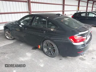 2015 BMW 4 Series 428i xDrive with VIN WBA4C9C57FD331872, listed as a IAAI auction lot 42276675 with 106,543 mi miles and . Bid and sale history available at DreamBid. Image 3.