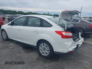 2012 Ford Focus SE with VIN 1FAHP3F25CL239383, listed as a IAAI auction lot 41656033 with 127,011 mi miles and . Bid and sale history available at DreamBid. Image 3.