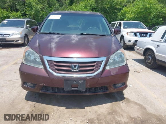 2010 Honda Odyssey Touring z VIN 5FNRL3H92AB010292, wystawiony jako IAAI lot #42469216 z przebiegiem 188 921 mil mil oraz . Historia ofert i sprzedaży dostępna na DreamBid. Obrazek 6.