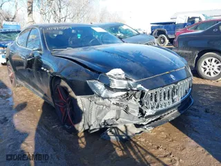 2014 Maserati Ghibli with VIN ZAM57XSA4E1090315, listed as a IAAI auction lot 41423507 with 115,323 mi miles. Bid and sale history available at carsss.com. Image 6.