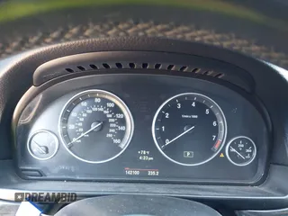 2013 BMW 5 Series 528i with VIN WBAXG5C56DD230121, listed as a IAAI auction lot 42019899 with 142,100 mi miles and . Bid and sale history available at carsss.com. Image 7.