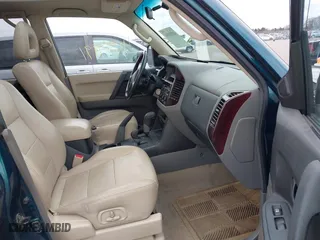 2002 Mitsubishi Montero LTD with VIN JA4MW51R82J003116, listed as a IAAI auction lot 41954991 with 223,784 mi miles. Bid and sale history available at carsss.com. Image 5.