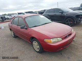 1997 Ford Escort LX with VIN 1FALP13P2VW392173, listed as a IAAI auction lot 41833271 with 123,991 mi miles. Bid and sale history available at carsss.com. Image 1.