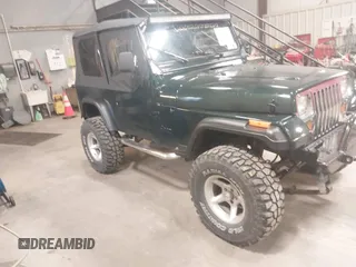 1995 Jeep Wrangler S z VIN 1J4FY19P6SP304205, wystawiony jako IAAI lot #42315451 z przebiegiem 74 613 mil mil oraz . Historia ofert i sprzedaży dostępna na DreamBid. Obrazek 1.