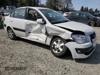 2009 Kia Rio LX with VIN KNADE223896456292, listed as a Copart auction lot 54990605 with 61,220 mi miles and Salvage Title. Bid and sale history available at DreamBid. Image 4.