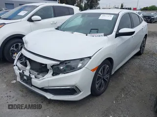 2020 Honda Civic LX with VIN 2HGFC2F64LH593100, listed as a IAAI auction lot 41877572 with 76,713 mi miles and . Bid and sale history available at DreamBid. Image 17.