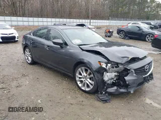 2016 Mazda Mazda6 i Touring with VIN JM1GJ1V56G1462637, listed as a IAAI auction lot 41603296 with 143,931 mi miles. Bid and sale history available at carsss.com. Image 1.