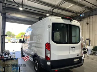 2018 Ford Transit with VIN 1FTYE1CM6JKB31142, listed as a IAAI auction lot 42785382 with 79,664 mi miles and . Bid and sale history available at DreamBid. Image 7.