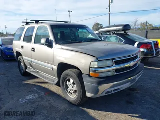2003 Chevrolet Tahoe LS with VIN 1GNEC13V13J163837, listed as a IAAI auction lot 41641915 with 102,312 mi miles. Bid and sale history available at carsss.com. Image 1.