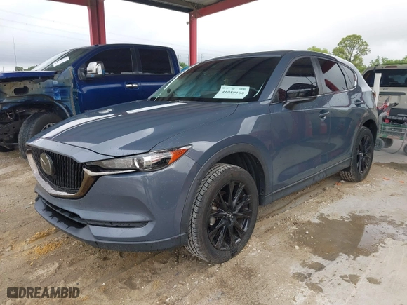 2021 Mazda CX-5 Touring with VIN JM3KFACM0M0327832, listed as a IAAI auction lot 41989199 with 42,396 mi miles. Bid and sale history available at carsss.com. Image 17.