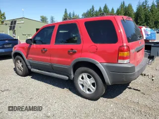 2002 Ford Escape XLT Choice with VIN 1FMCU04122KB12659, listed as a Copart auction lot 63816155 with 256,536 mi miles and Salvage title. Bid and sale history available at DreamBid. Image 2.