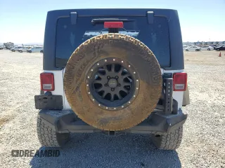 2016 Jeep Wrangler Unlimited Sport with VIN 1C4BJWDG0GL309976, listed as a Copart auction lot 63340505 with 66,714 mi miles and Salvage title. Bid and sale history available at DreamBid. Image 6.