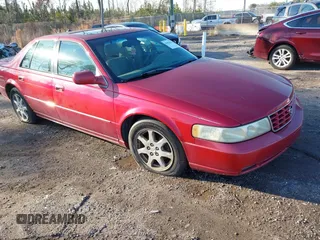 2003 Cadillac Seville Touring STS z VIN 1G6KY54983U212944, wystawiony jako IAAI lot #41656796 z przebiegiem 118 662 mil mil oraz . Historia ofert i sprzedaży dostępna na DreamBid. Obrazek 1.
