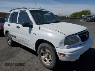 2003 Suzuki Vitara z VIN 2S3TE52V936103533, wystawiony jako Copart lot #55297135 z przebiegiem 122 230 mil mil oraz Szkody całkowita. Historia ofert i sprzedaży dostępna na DreamBid. Obrazek 4.
