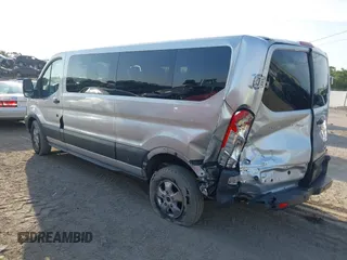 2018 Ford Transit Passenger XL with VIN 1FBZX2YM0JKA70128, listed as a IAAI auction lot 42379000 with 125,309 mi miles and . Bid and sale history available at DreamBid. Image 3.