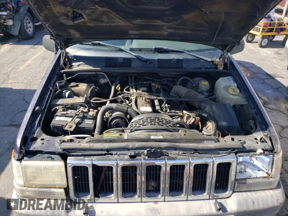 1998 Jeep Grand Cherokee Laredo with VIN 1J4GZ58S8WC167716, listed as a Copart auction lot 76477694 with 167,519 mi miles and Salvage Title. Bid and sale history available at carsss.com. Image 12.