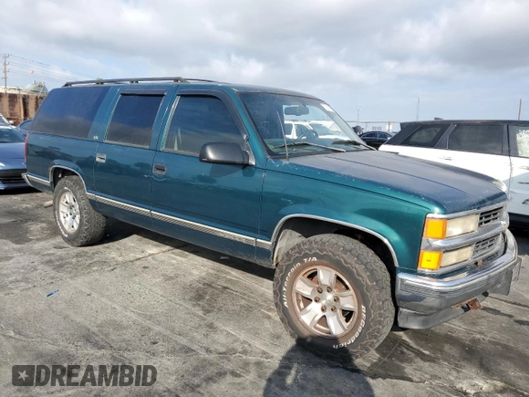1997 Chevrolet Suburban with VIN 3GNFK16R4VG163602, listed as a Copart auction lot 76081984 with 243,169 mi miles and Salvage Title. Bid and sale history available at carsss.com. Image 4.