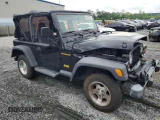 2002 Jeep Wrangler Sport with VIN 1J4FA49S12P730135, listed as a Copart auction lot 54477835 with 148,153 mi miles and Salvage title. Bid and sale history available at DreamBid. Image 4.