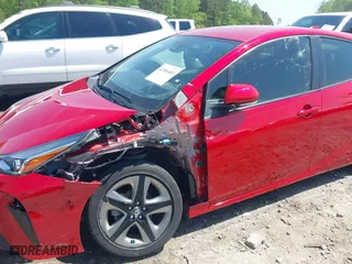 2021 Toyota Prius L Eco with VIN JTDKAMFU3M3138708, listed as a IAAI auction lot 42006401 with 38,876 mi miles. Bid and sale history available at carsss.com. Image 6.