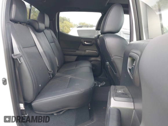 2023 Toyota Tacoma SR z VIN 3TMCZ5AN1PM637609, wystawiony jako IAAI lot #40345917 z przebiegiem 12 614 mil mil oraz . Historia ofert i sprzedaży dostępna na DreamBid. Obrazek 8.