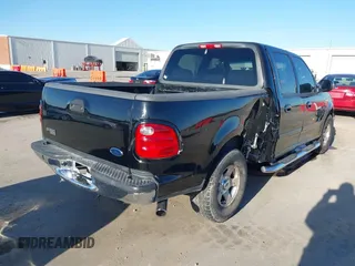 2002 Ford F-150 XLT with VIN 1FTRW07622KD31203, listed as a IAAI auction lot 41401506 with 166,949 mi miles. Bid and sale history available at carsss.com. Image 4.