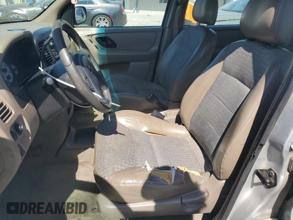 2002 Ford Escape XLS Choice with VIN 1FMYU02112KB00947, listed as a Copart auction lot 48948855 with 223,287 mi miles and Salvage title. Bid and sale history available at DreamBid. Image 7.