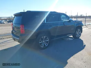 2015 Chevrolet Tahoe LTZ with VIN 1GNSCCKC8FR581994, listed as a IAAI auction lot 41406219 with 187,802 mi miles. Bid and sale history available at carsss.com. Image 4.