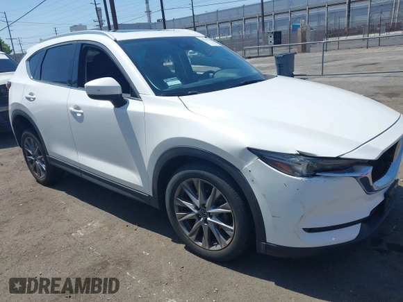 2020 Mazda CX-5 Grand Touring with VIN JM3KFADM9L0821930, listed as a IAAI auction lot 42549986 with 29,929 mi miles and . Bid and sale history available at DreamBid. Image 6.