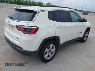 2019 Jeep Compass Latitude with VIN 3C4NJCBB9KT652088, listed as a IAAI auction lot 42162439 with 97,276 mi miles and . Bid and sale history available at DreamBid. Image 4.