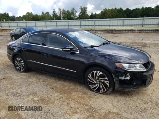 2014 Volkswagen CC R-Line with VIN WVWBP7AN9EE501261, listed as a Copart auction lot 75701194 with 73,123 mi miles and Salvage Title. Bid and sale history available at carsss.com. Image 4.