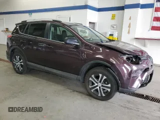 2016 Toyota RAV4 LE with VIN 2T3BFREV3GW490181, listed as a Copart auction lot 52457435 with 128,267 mi miles and Salvage Title. Bid and sale history available at DreamBid. Image 4.