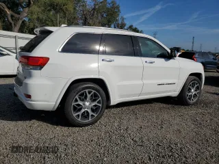 2019 Jeep Grand Cherokee Overland with VIN 1C4RJFCT2KC834690, listed as a Copart auction lot 84303144 with 63,053 mi miles and Salvage Title. Bid and sale history available at carsss.com. Image 3.