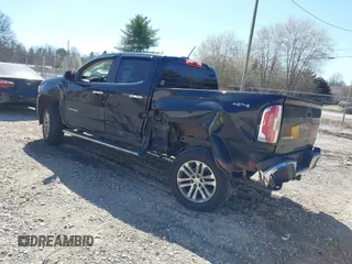 2015 GMC Canyon 2WD SLT with VIN 1GTG5CE35F1249224, listed as a IAAI auction lot 41697796 with 180,230 mi miles. Bid and sale history available at carsss.com. Image 3.