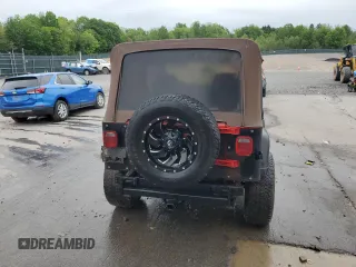 1995 Jeep Wrangler S z VIN 1J4FY19P0SP320982, wystawiony jako Copart lot #58615045 z przebiegiem 156 123 mil mil oraz Czysty tytuł • Clean title. Historia ofert i sprzedaży dostępna na DreamBid. Obrazek 6.