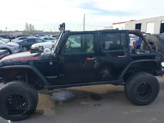 2009 Jeep Wrangler Unlimited Rubicon z VIN 1J4GA69159L749215, wystawiony jako IAAI lot #41489893 z przebiegiem 177 768 mil mil oraz . Historia ofert i sprzedaży dostępna na DreamBid. Obrazek 14.
