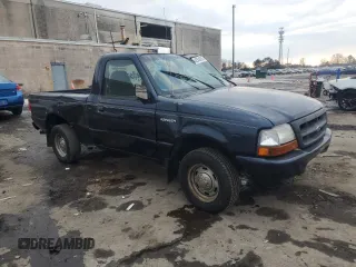 1999 Ford Ranger XL with VIN 1FTYR10C8XTA00586, listed as a Copart auction lot 42546635 with 176,902 mi miles and Salvage title. Bid and sale history available at DreamBid. Image 4.