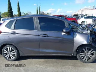 2015 Honda Fit EX-L z VIN 3HGGK5H89FM774299, wystawiony jako IAAI lot #41793448 z przebiegiem 142 228 mil mil oraz . Historia ofert i sprzedaży dostępna na DreamBid. Obrazek 13.